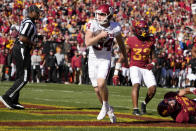 Oklahoma place kicker Zach Schmit (34) celebrates after scoring a touchdown on a fake field goal attempt during the first half of an NCAA college football game against Iowa State, Saturday, Oct. 29, 2022, in Ames, Iowa. (AP Photo/Charlie Neibergall)