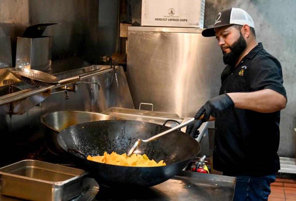 Antonio Estrada cooks tortilla chips at the new Tacos El Jefe Mexican Restaurant opening soon in Fort Valley.