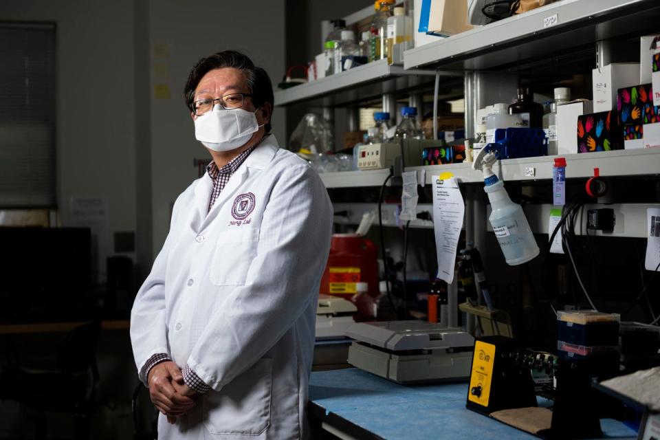 University Distinguished Professor of Molecular Virology Dr. Xiang-Jin Meng poses for a portrait in his lab on March 23, 2021. Meng is a member of Virginia Tech’s Department of Biomedical Sciences and Pathobiology.