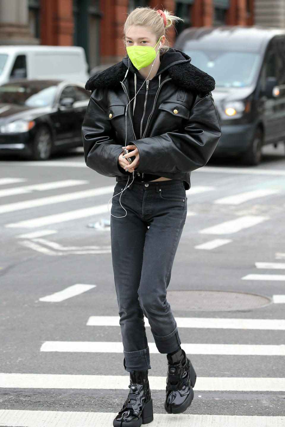 <p><em>Euphoria</em> star Hunter Schafer steps out in all black and a neon green mask on Monday in N.Y.C.</p>