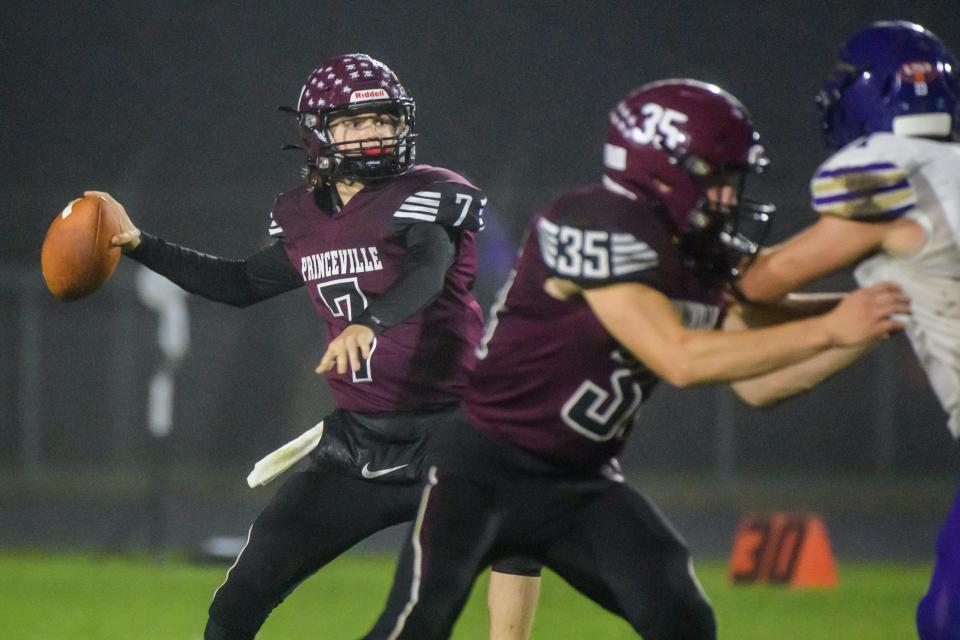 Princeville quarterback Logan Carruthers looks for a receiver as the Princes battle Rushville-Industry in the first half of their Week 8 football game Friday, Oct. 13, 2023 at Princeville High School.