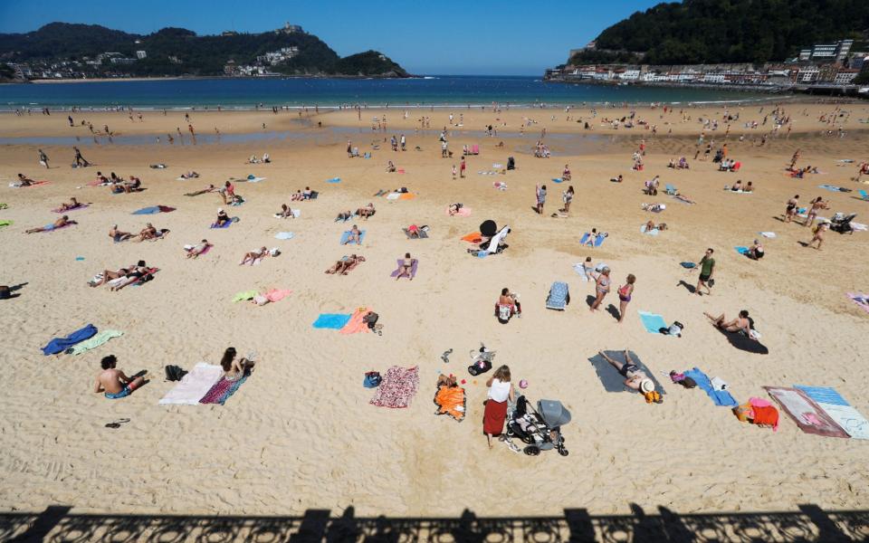 Sun bathers have begun returning to Spanish beaches, but social distancing measures are still in place - Javier Etxezarreta/EPA-EFE/Shutterstock/Shutterstock