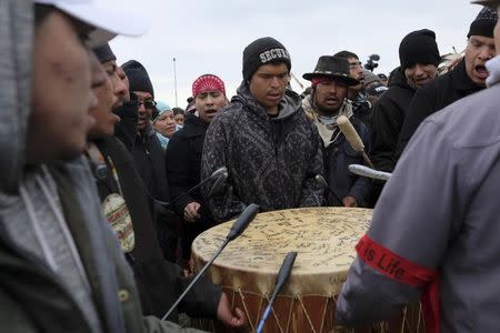 Drummers lead hundreds of peaceful protesters back to the Oceti Sakowin campground after a prayerful demonstration near the Dakota Access Pipeline construction site north of Cannon Ball, North Dakota, U.S. on October 29, 2016. REUTERS/Josh Morgan