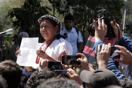 Maria de Jesus Patricio Martinez, an indigenous woman backed by Mexico's Zapatista National Liberation Army (EZLN), shows a document after she registered to run as an independent candidate in next year's presidential election at National Electoral Institute (INE) in Mexico City, Mexico, October 7, 2017. REUTERS/Violeta Schmidt