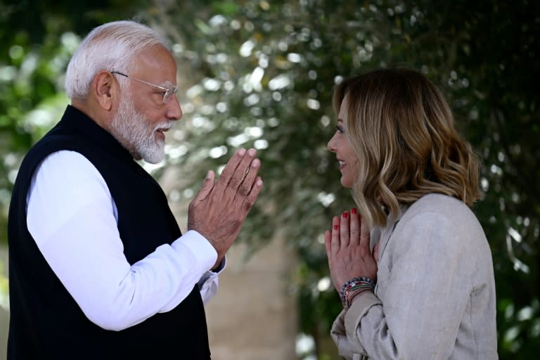 Indian Prime Minister Narendra Modi is welcomed by Italy's Prime Minister Giorgia Meloni on June 14 (Filippo MONTEFORTE)