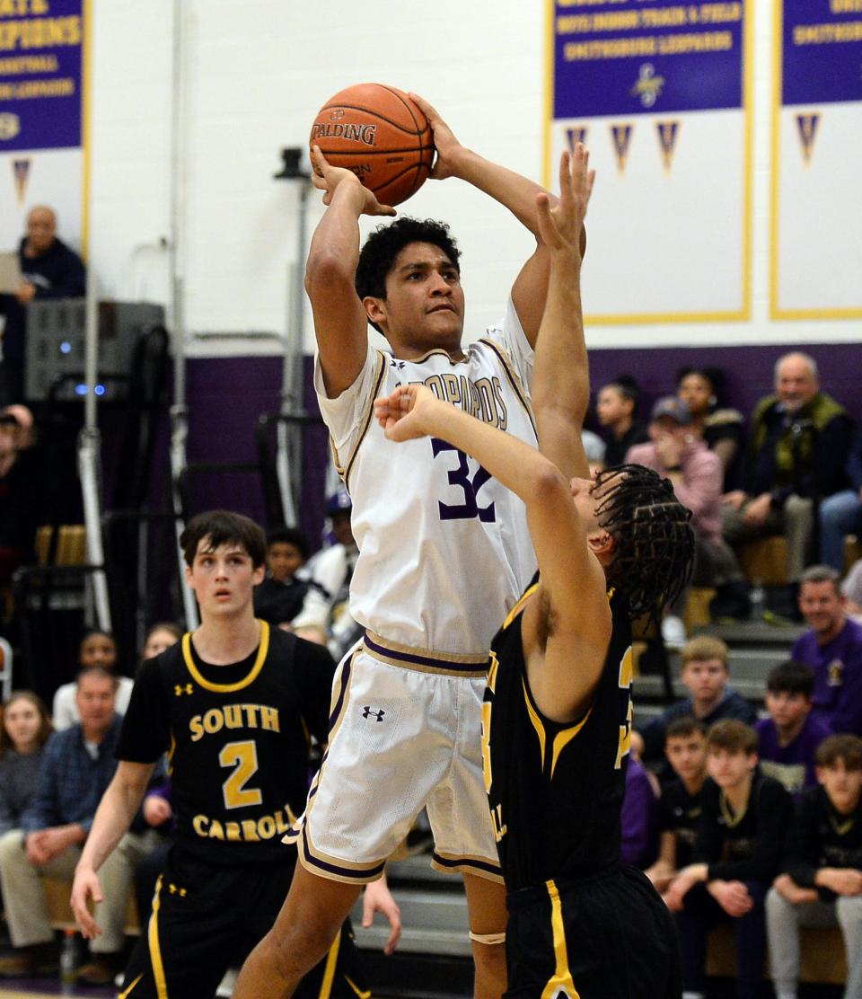Smithsburg's Josh Summers shoots over South Carroll's Nathan Houston during the Leopards' 76-70 victory for the 1A West Region II title.