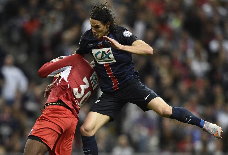 Paris Saint-Germain's Uruguyan forward Edinson Cavani (R) vies with Auxerre's goalkeeper Donovan Leon during the French Cup final football match on May 30, 2015 at the Stade de France in Saint-Denis, north of Paris