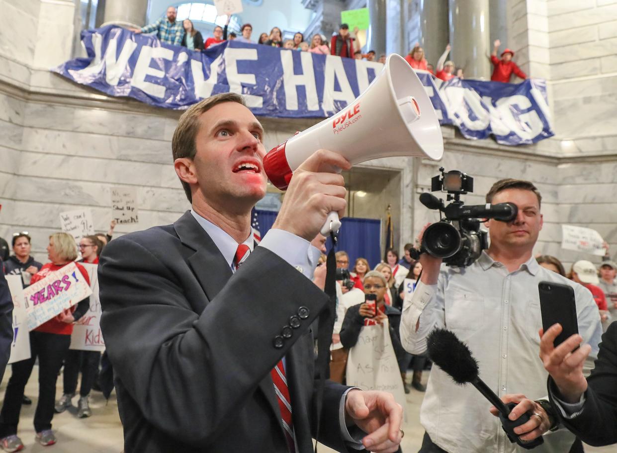 Then-Attorney General Andy Beshear spoke to the crowd as hundreds of teachers from across Kentucky rallied in Frankfort in March 2018 over pension reform legislation.