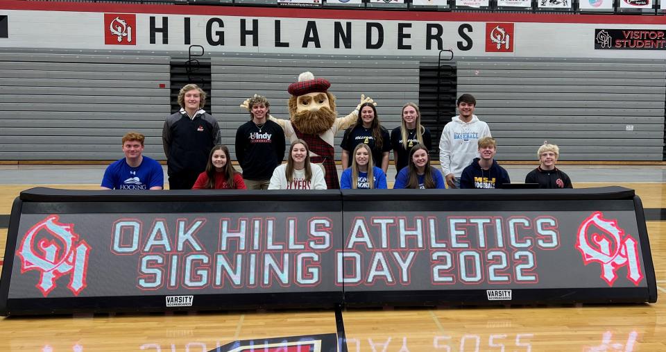 Oak Hills High School celebrated National Signing Day Feb. 2 with a ceremony in the school gym. Signing were, from left: Front, Adam Lipps, Hocking College baseball; Lily Hayes, Miami University Hamilton softball; Jillian Yates, University of Dayton track and field; Lexi Williams, Thomas More University lacrosse; Rachel Blevins, Thomas More University lacrosse; Bailey Wallace, Mount St. Joseph University football; Brandon Mitchell, Mount St. Joseph University wrestling; back, Jameson Richmond, University of Louisville baseball; Doug Spreen, University of Indianapolis baseball; Highlander; Riley Broughton, Mount St. Joseph University volleyball; Riley Grove, Mount St. Joseph University volleyball; Ian Schaefer, Olney Central College baseball