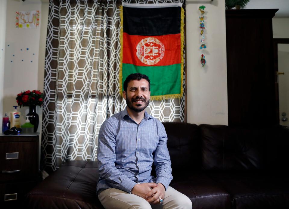 Shamsurahman Zaland poses for a photo in his apartment in Dublin on June 7, 2021. Zaland, a refugee from Afghanistan, came here in 2018 with a Special Immigrant Visa for his work with the U.S. government. 