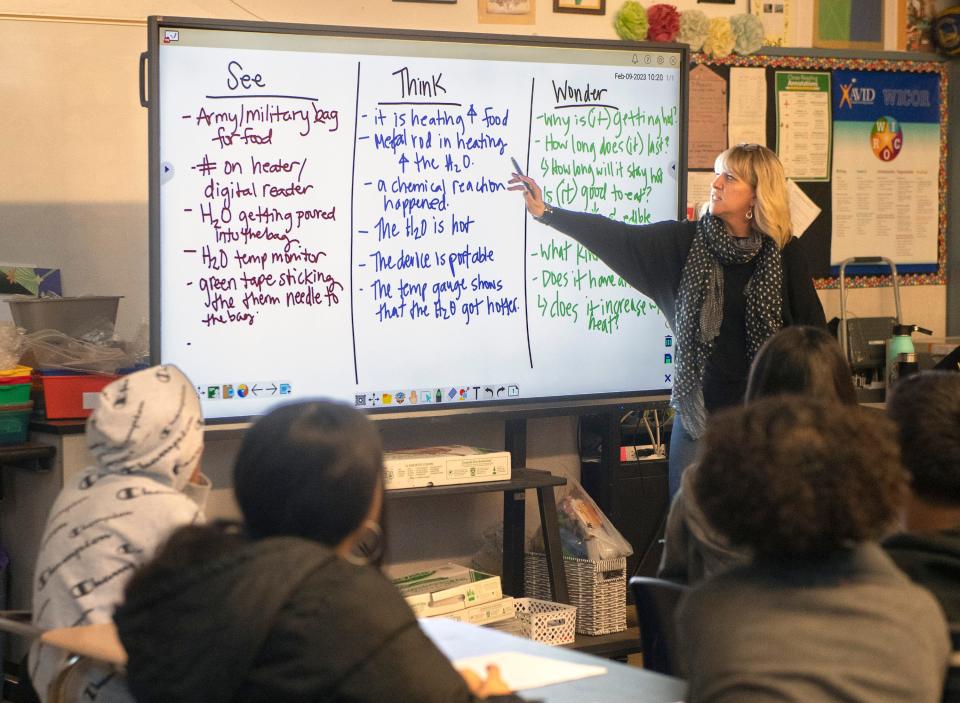 Teacher Dr. Shana Cole goes over a lesson in a seventh and eighth grade class at Fremont School in Stockton on Thursday, Feb. 9, 2023.