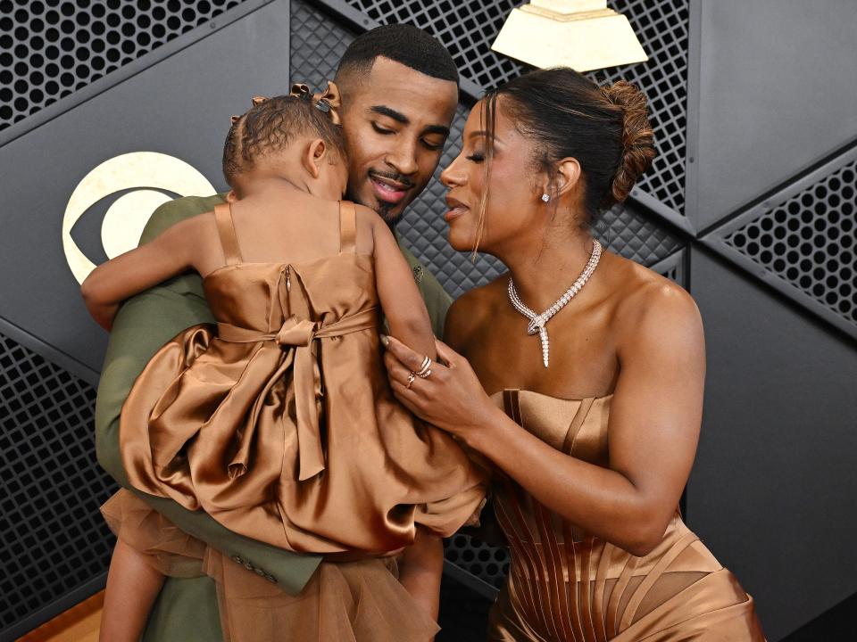 John Gaines, Victoria Monét and Hazel Monét Gaines at the 66th Annual GRAMMY Awards held at Crypto.com Arena on February 4, 2024 in Los Angeles, California.