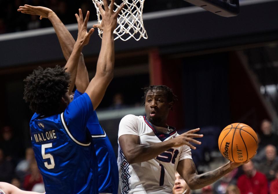 Southern Indiana’s Isaiah Swope (1) passes around Eastern Illinois’ Sincere Malone (5) as the University of Southern Indiana Screaming Eagles play the Eastern Illinois University Panthers at Screaming Eagles Arena in Evansville, Ind., Thursday, Jan. 26, 2023.