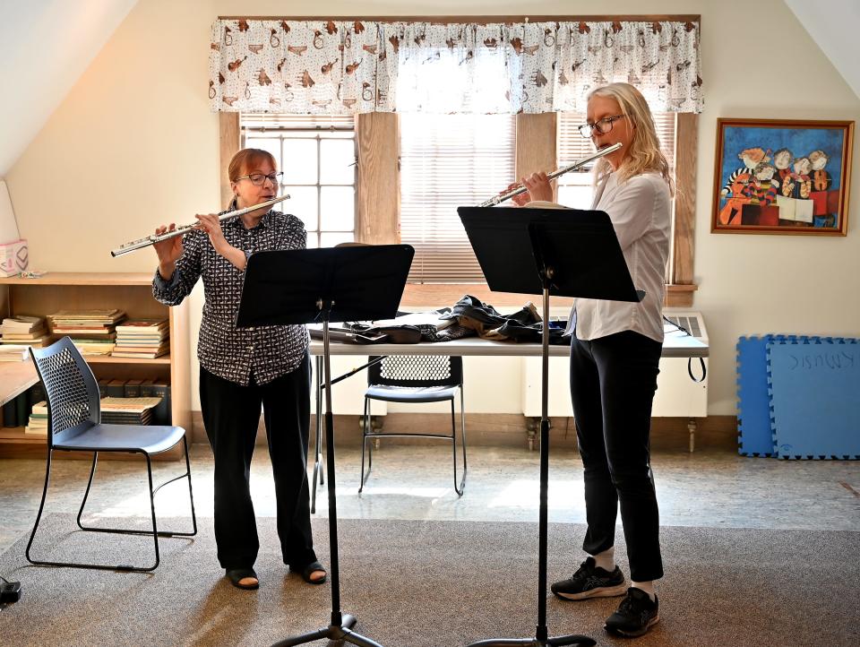 Sarah Smongeski, left, teaches flute to Lynn Fantelli of Upton. although Smongeski is retiring as executive director of Pakachoag Music School, she anticipates that she'll continue teaching and doing "some part-time work behind the scenes."