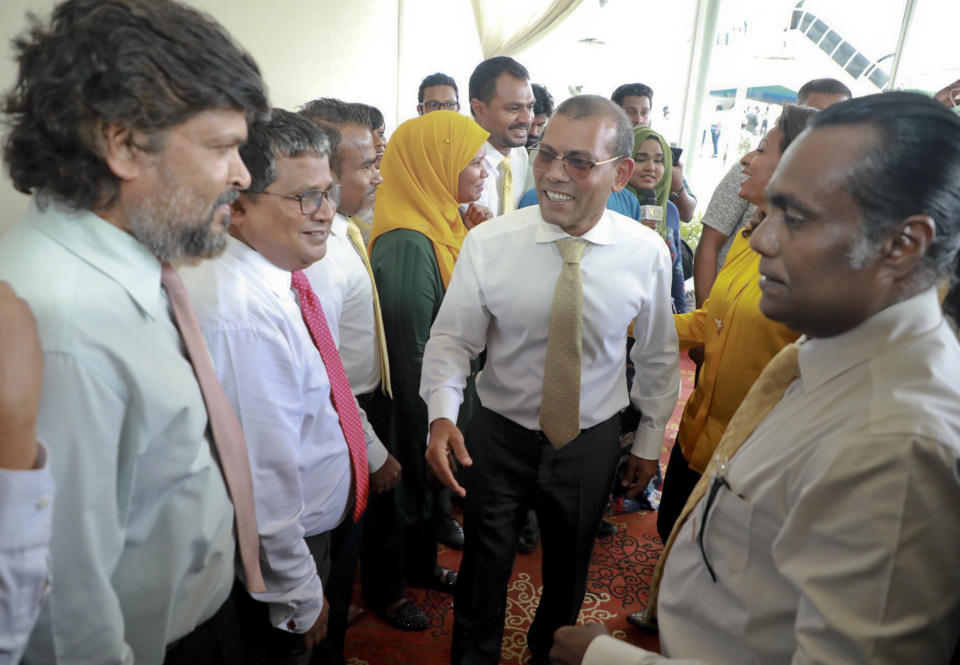 Maldives’ former president Mohamed Nasheed, center is received by supportesr, at the airport in Male, Maldives, Thursday, Nov.1, 2018. Nasheed returned to Maldives Thursday after living in exile for more than two years. (AP Photo/Mohamed Sharuhaan)