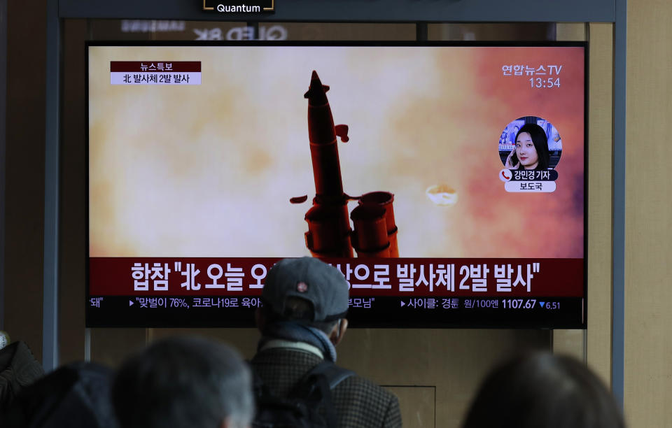 People watch a TV screen showing a news program reporting about North Korea's firing of projectiles with a file image at the Seoul Railway Station in Seoul, South Korea, Monday, March 2, 2020. North Korea fired two unidentified projectiles into its eastern sea on Monday as it begins to resume weapons demonstrations after a months-long hiatus that could have been forced by the coronavirus crisis in Asia. The Korean letters read: "Joint Chiefs of Staff, North Korea fired two projectiles." (AP Photo/Lee Jin-man)