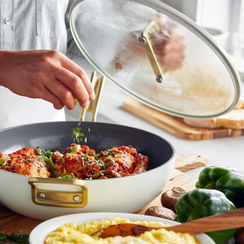 white ceramic saute pan with glass lid and meatballs cooking