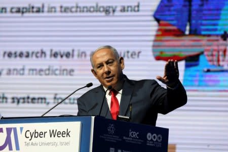 Israeli Prime Minister Benjamin Netanyahu gestures as he speaks during the Cyber Week conference at Tel Aviv University, Israel, June 20, 2018. REUTERS/Ammar Awad