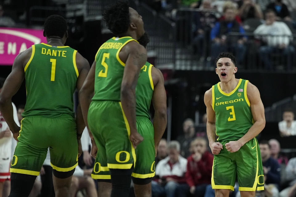 Oregon guard Jackson Shelstad (3) celebrates after a play against Arizona during the second half of an NCAA college basketball game in the semifinal round of the Pac-12 tournament Friday, March 15, 2024, in Las Vegas. (AP Photo/John Locher)