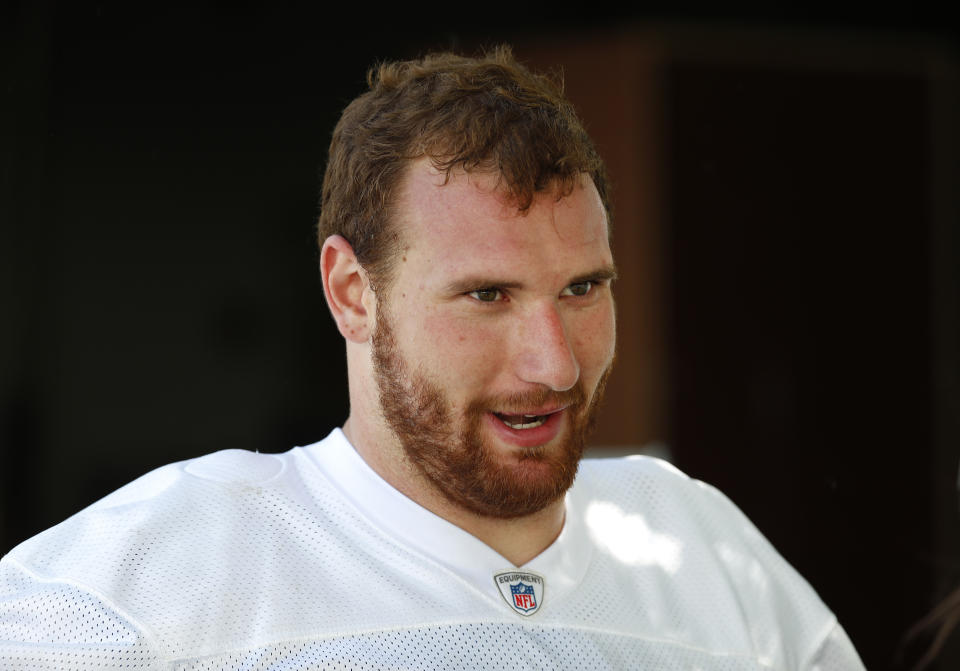 FILE - Detroit Lions offensive lineman Frank Ragnow talks after an NFL football practice in Allen Park, Mich., in this Monday, June 11, 2018, file photo.The Detroit Lions have signed Pro Bowl center Frank Ragnow to a $54 million, four-year extension that keeps him under contract through the 2026 season. The team announced the deal Friday, May 7, 2021, investing in one of the franchise’s building blocks under general manager Brad Holmes and coach Dan Campbell. (AP Photo/Paul Sancya, File)