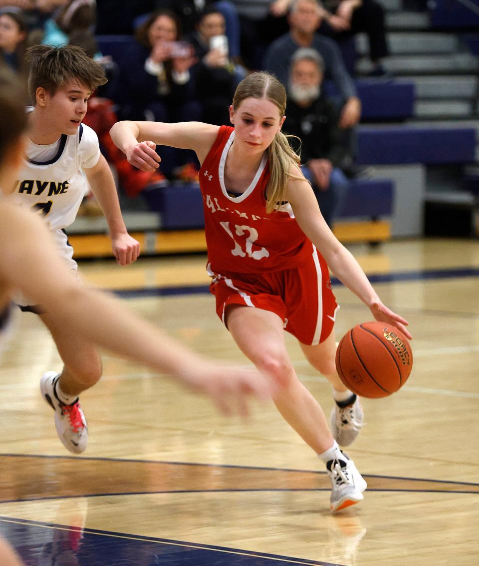 Pal-Mac’s Taryn Goodness drives to the basket against Wayne’s Kasey Eaton.