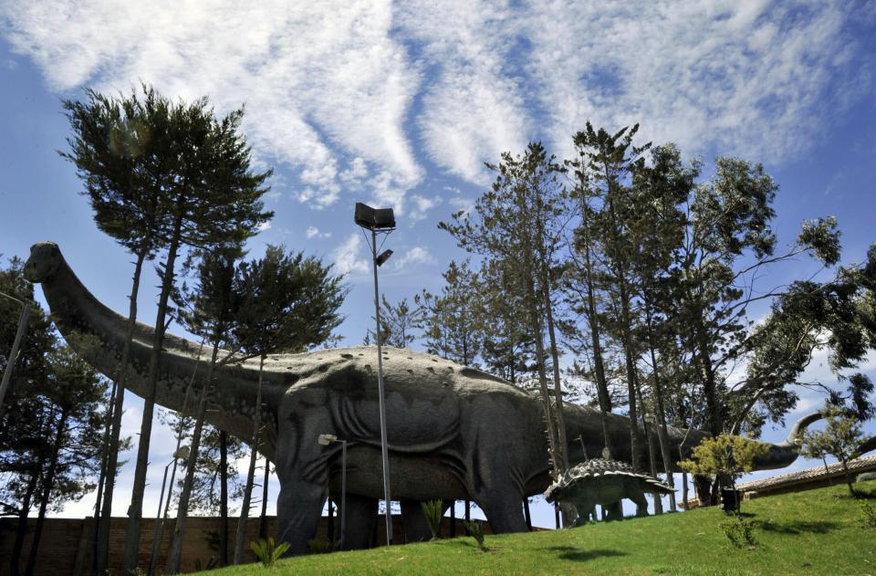 View of a Titanosaur replica on dispaly at the Cretaceous Park in Cal Orcko hill in Sucre, on September 17, 2014. More than 5,000 pawprints of 20 species of dinosaurs can be found at the Cal Orcko.  AFP PHOTO/Aizar Raldes        (Photo credit should read AIZAR RALDES/AFP via Getty Images)