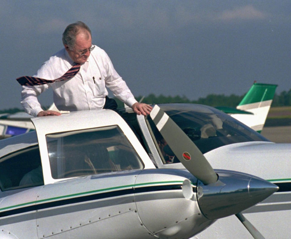 Bailey hopping into his private plane after being released from federal prison in 1996