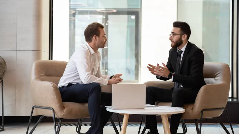 A man meets with his financial advisor to discuss the elements of their relationship that he would like to improve. 