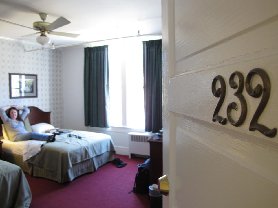 In this photo, taken Saturday, Feb. 25, 2012, at the Green Park Inn in Blowing Rock, N.C., a guest relaxes in one of the historic hotel's 52 spacious rooms. The property started as a boarding house in 1882. (AP Photo/Allen Breed)