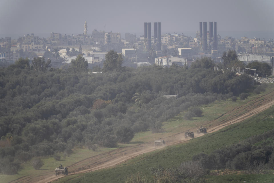 Israeli forces move near the Israeli-Gaza border, in southern Israel, Thursday, Jan. 18, 2024. The army is battling Palestinian militants across Gaza in the war ignited by Hamas' Oct. 7 attack on Israel. (AP Photo/Ohad Zwigenberg)