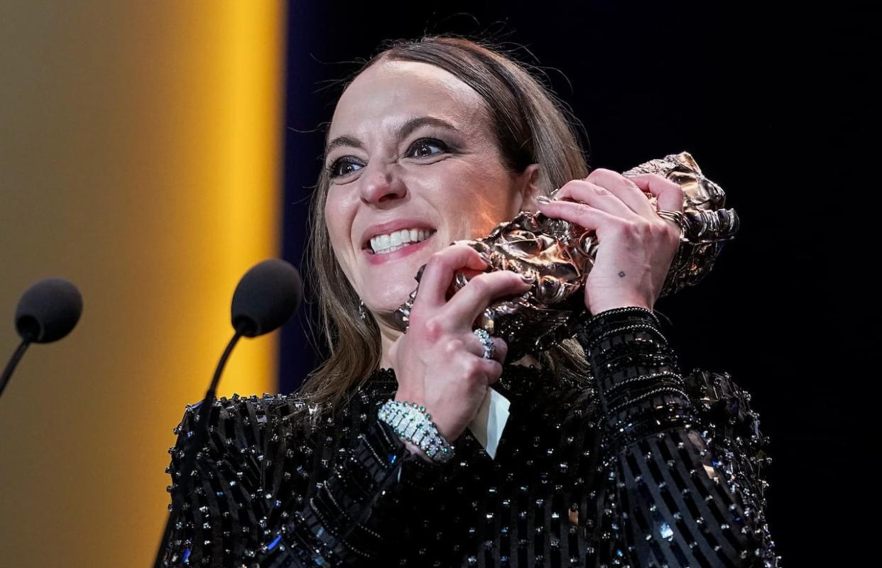 Monia Chokri holds the Best Foreign Film César Award for the movie Simple Comme Sylvain during the 49th César Awards ceremony in Paris. (Michel Euler/AP - image credit)