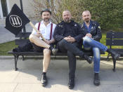 In this photo was taken April 6, 2019, activists Rafał Suszek, left, Michał Wojcieszczuk, center, and Konrad Korzeniowski, who toppled a statue of an alleged pedophile priest pose for a picture on the sidelines of an anti-fascist rally in Warsaw, Poland. A documentary film with testimony by victims of clerical abuse in Poland is so harrowing that it has forced an unprecedented reckoning with the problem in one of Europe’s most deeply Catholic societies. (AP Photo/Grzegorz Lach)