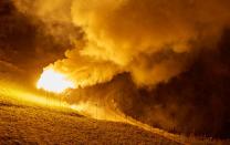 Flares of magnesium powder are pictured during the illumination to celebrate Swiss National Day in Evolene