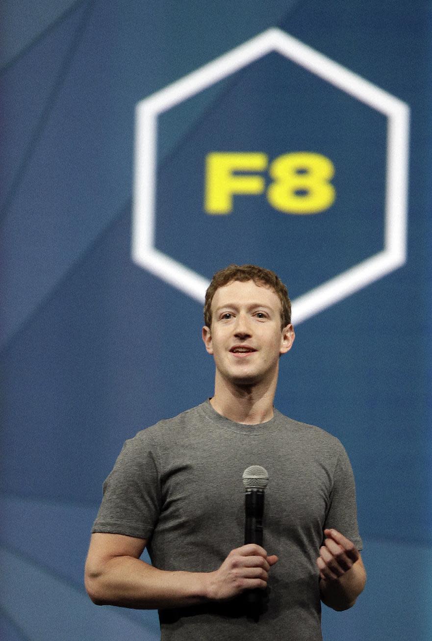 Facebook CEO Mark Zuckerberg gestures while delivering the keynote address at the f8 Facebook Developer Conference Wednesday, April 30, 2014, in San Francisco. (AP Photo/Ben Margot)