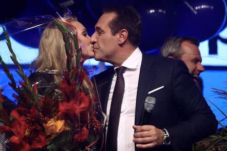 Top candidate and head of far-right Freedom Party (FPOe) Heinz-Christian Strache kisses his wife Philippa Beck as they attend party meeting after Austria's general election in Vienna, Austria, October 15, 2017. REUTERS/Michael Dalder