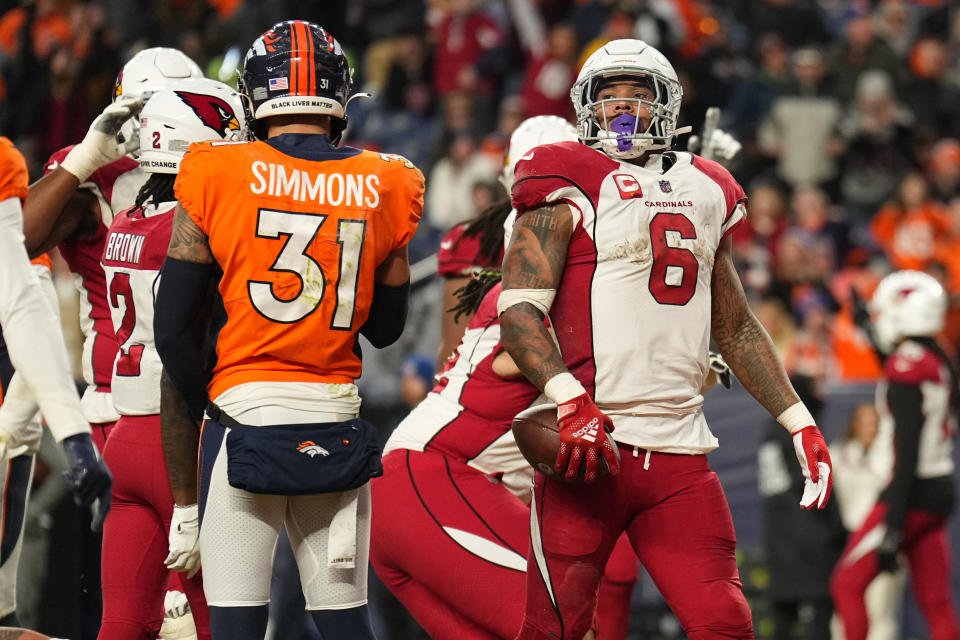 Arizona Cardinals running back James Conner (6) scores a touchdown against the Denver Broncos during the second half of an NFL football game, Sunday, Dec. 18, 2022, in Denver. (AP Photo/Jack Dempsey)