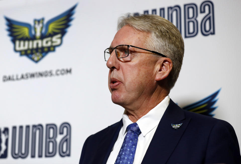 Newly hired WNBA's Dallas Wings head coach Brian Agler responds to questions from reporters after a news conference where Agler was officially introduced, Tuesday, Dec. 18, 2018, in Arlington, Texas. (AP Photo/Tony Gutierrez)