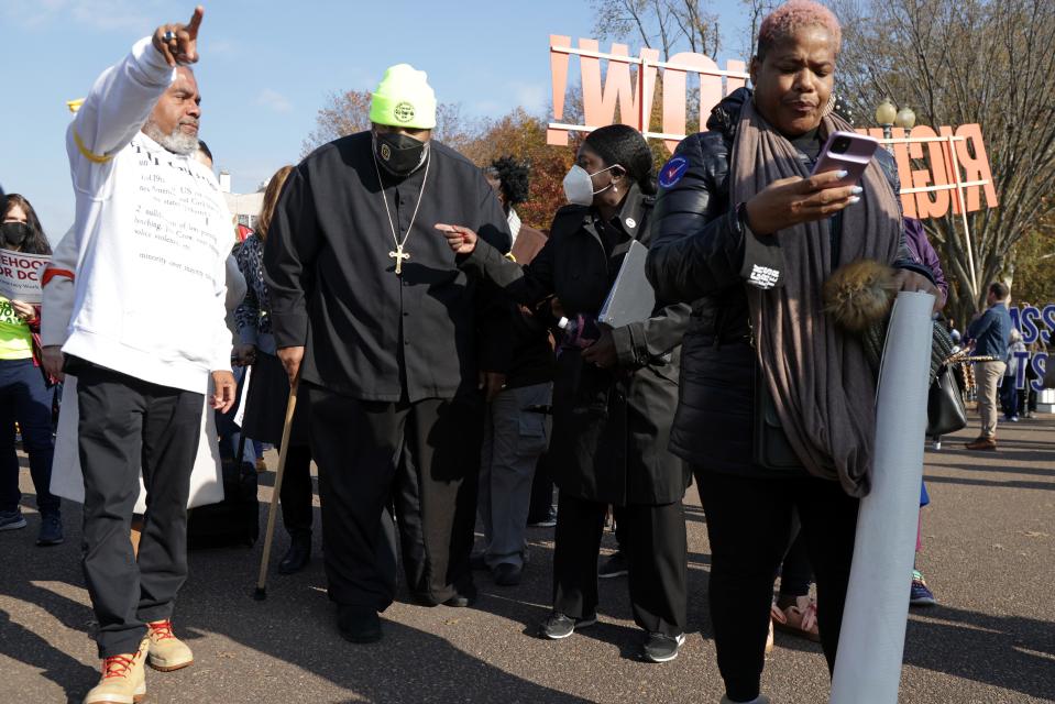 The Rev. William Barber II, second from left, of the Poor People's Campaign, took part in a voting rights protest in front of the White House Nov. 17, 2021, in Washington, D.C. Voting rights activists pressed Congress and the White House to pass voting rights legislation.