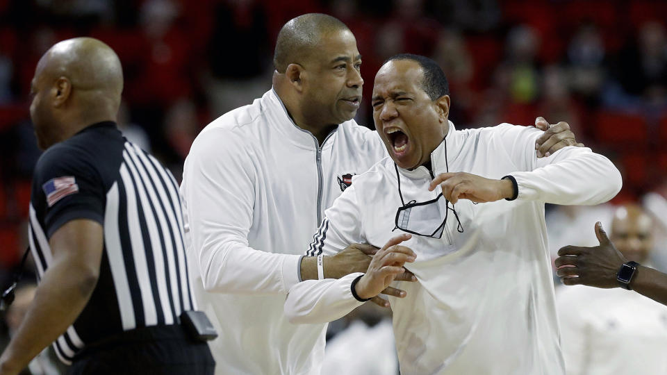 North Carolina State coach Kevin Keatts, right, reacts after being ejected during the first half of the team's NCAA college basketball game against Wake Forest on Tuesday, Jan. 16, 2024, in Raleigh, N.C. (Kaitlin McKeown/The News & Observer via AP)