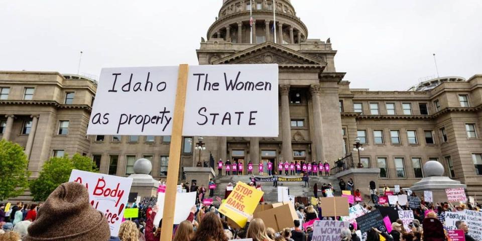 An attendee at an abortion rights rally holds a sign outside the Idaho Capitol on May 14.