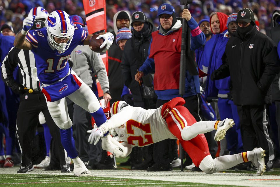 Buffalo Bills wide receiver Khalil Shakir (10) is pulled out of bounds by Kansas City Chiefs safety Chamarri Conner (27) during the fourth quarter of an NFL AFC division playoff football game, Sunday, Jan. 21, 2024, in Orchard Park, N.Y. (AP Photo/Jeffrey T. Barnes)