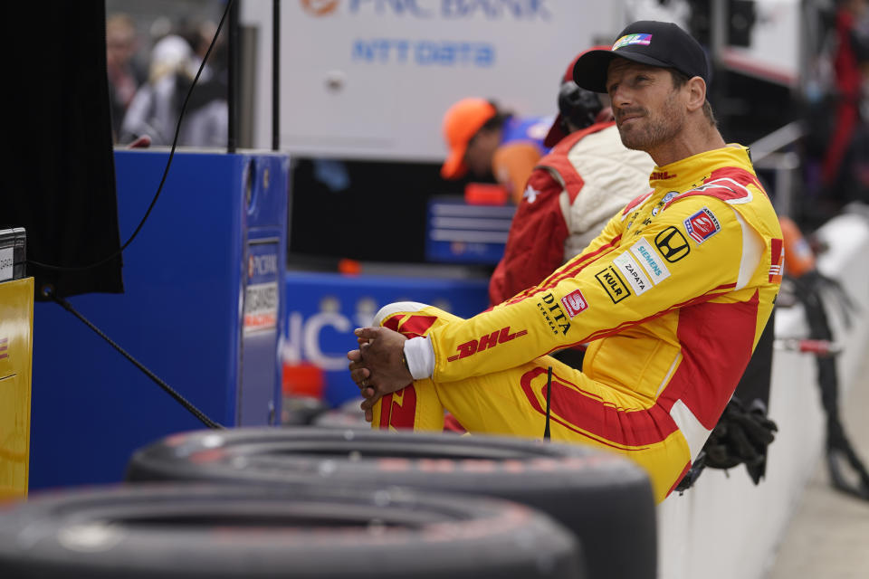 Romain Grosjean, of France, sits on pit wall before practice for the Indianapolis 500 auto race at Indianapolis Motor Speedway, Sunday, May 22, 2022, in Indianapolis. (AP Photo/Darron Cummings)