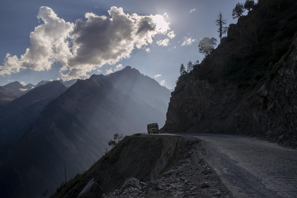 A lone truck travels on the Zojila Pass, northeast of Srinagar, Indian controlled Kashmir, Monday, Sept. 27, 2021. High in a rocky Himalayan mountain range, hundreds of people are working on an ambitious project to drill tunnels and construct bridges to connect the Kashmir Valley with Ladakh, a cold-desert region isolated half the year because of massive snowfall. The $932 million project’s last tunnel, about 14 kilometers (9 miles) long, will bypass the challenging Zojila pass and connect Sonamarg with Ladakh. Officials say it will be India’s longest and highest tunnel at 11,500 feet (3,485 meters). (AP Photo/Dar Yasin)