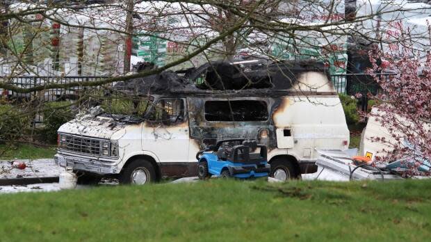 A fire in a camper van parked in East Vancouver Saturday killed a man in his 50s, and burned a 29-year-old woman, according to police. (Shane Mackichan - image credit)