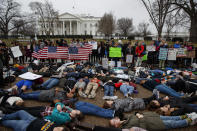 <p>Demonstrators participate in a “lie-in” during a protest in favor of gun control reform in front of the White House, Monday, Feb. 19, 2018, in Washington. (Photo: Evan Vucci/AP) </p>