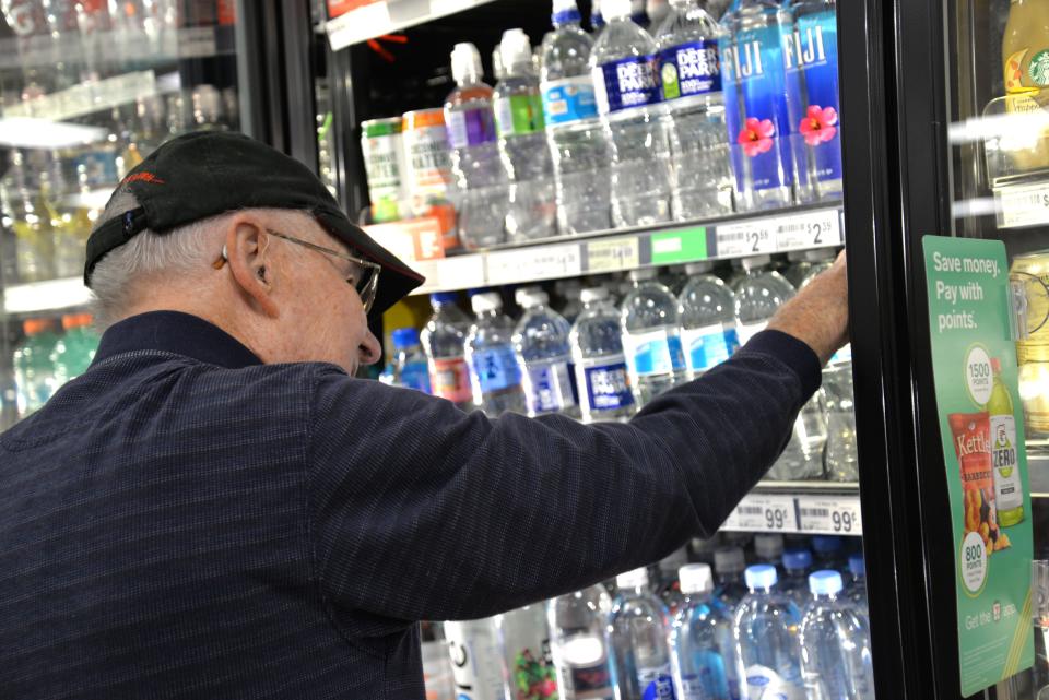 Orin Gilbert Jr. comes to the 7-Eleven at Myers Corner almost daily at 5 a.m. to help straighten up, fold pizza boxes and check on coffee.