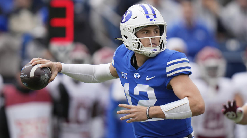 BYU quarterback Jake Retzlaff (12) throws against Oklahoma during the first half of an NCAA college football game Saturday, Nov. 18, 2023, in Provo, Utah. (AP Photo/Rick Bowmer)