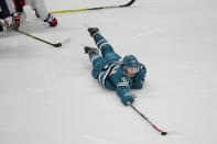 San Jose Sharks center Tomas Hertl reaches for the puck during the third period of an NHL hockey game against the Washington Capitals in San Jose, Calif., Saturday, March 4, 2023. (AP Photo/Jeff Chiu)