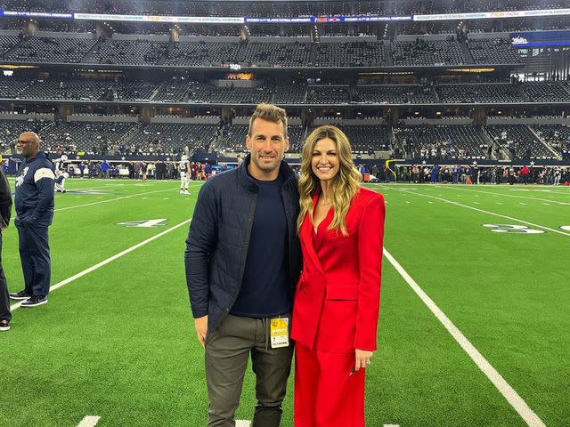 <p>Erin Andrews Instagram</p> Erin Andrews with her husband Jarret Stoll pose together on a football field.