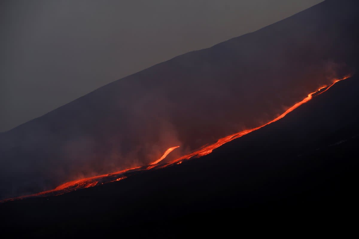 File image shows lava flowing down Mount Etna’s slopes. Sicily is home to Europe’s most active volcano, though there hasn’t been a deadly, major eruption since 1922 (REUTERS)